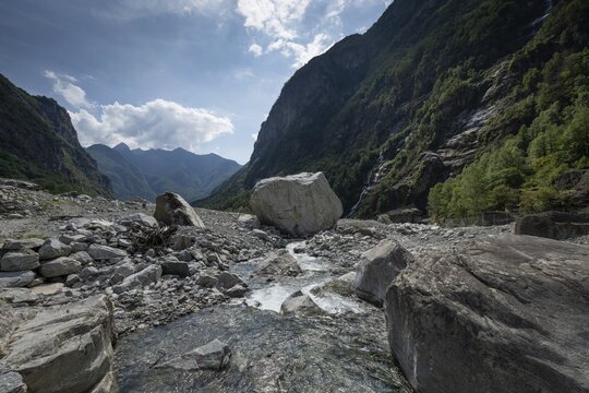 Large boulders lie in the Bavona River riverbed as a result of heavy rock and debris flow on the night of June 29-30, 2024 following heavy rains, hamlet of Fontana, Bavona Valley or Val Bavona, Maggia Valley, Tessin, Switzerland