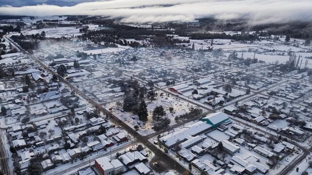 Aerial Drone Tilt Up Melipeuco Town Streets Snow Roofs Andes Chile Landscape