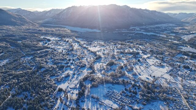 Aerial Drone flight at Melipeuco Snow Dawn Mountain Valley Forest Town Chilean Landscape