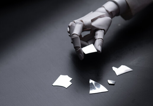 Robot Hand Touching Broken Glass Pieces Concept of System Error and Failure