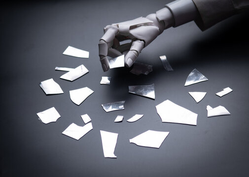 Robot Hand Touching Broken Glass Pieces Concept of System Error and Failure