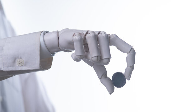 Robotic Hand Holding Blank Metal Coin Isolated on White Background