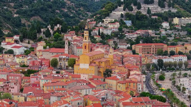 Colorful old town buildings and church tower in Menton, France, seen from above