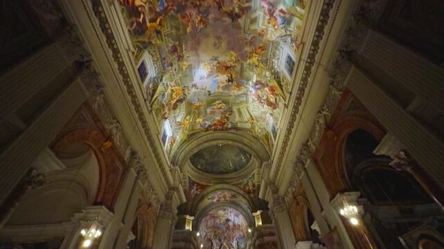 Grand Baroque Cathedral Interior With Ornate Ceiling Frescoes, Marble Columns and Illuminated Altar During Service in Rome, Italy