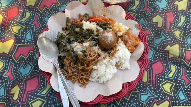 Traditional Indonesian Nasi Rames Mixed Rice On Paper Plate