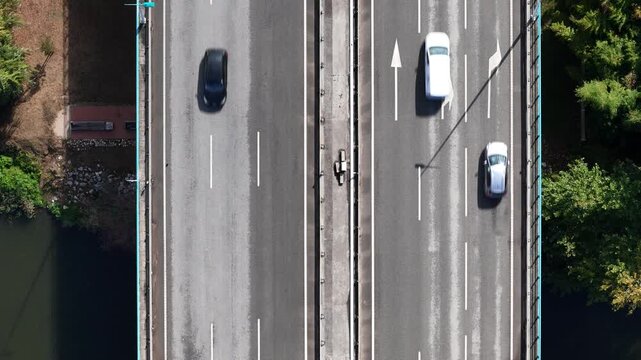 Aerial view of Ponte Rainha Santa Isabel with cars driving on the bridge in Coimbra, Coimbra, Portugal.