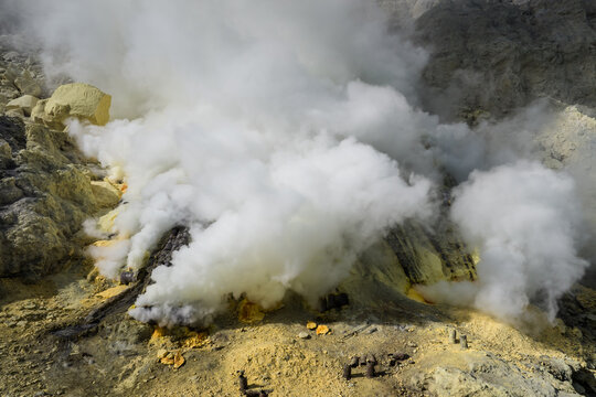 Aerial view of the sulfurous, smoking natural scenery of Ijen volcanic lake on Java Island, Indonesia.