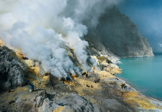 Aerial view of the sulfurous, smoking natural scenery of Ijen volcanic lake on Java Island, Indonesia.