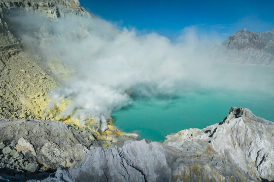 Aerial view of the sulfurous, smoking natural scenery of Ijen volcanic lake on Java Island, Indonesia.