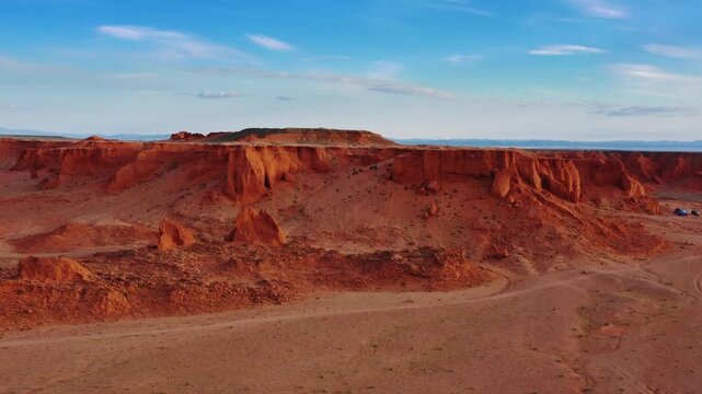 Aerial view of the red sandstone formations of the Flaming Cliffs in Bulgan, Omnogovi, Mongolia.