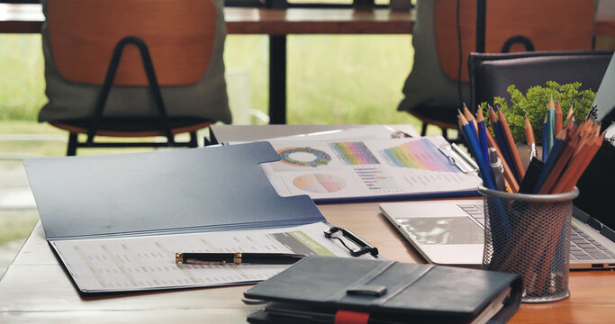 Banner Excel graph with Spreadsheet Document showing Information Financial Startup Concept. Banner Office laptop business financial document chart and graph on office wooden table coffee cup.
