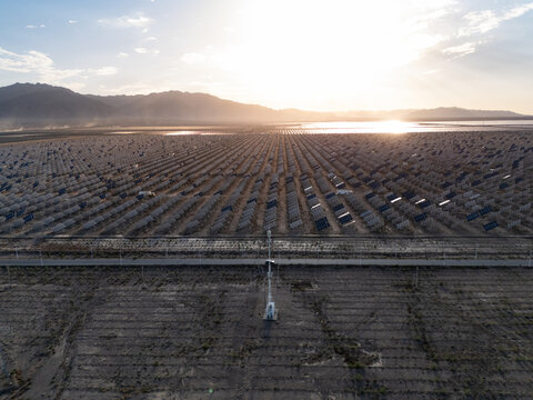 Panoramic view of vast solar power station at sunset