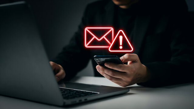 Person using smartphone checking suspicious email warning with alert symbol overlay