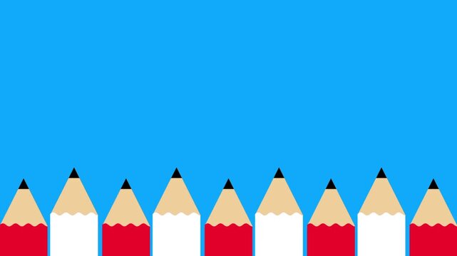 Bright blue sky backdrop with a neat evenly spaced row of sharpened red and tan pencils standing upright along the bottom edge great for creative flat