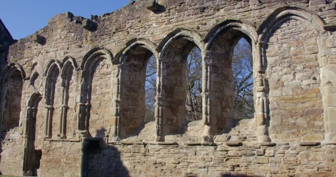 Zoom in shot of stone mullion windows at Basingwerk Abbey