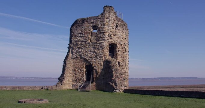 Wide zoom in shot of the northeast tower of Flint castle from the Inner ward,