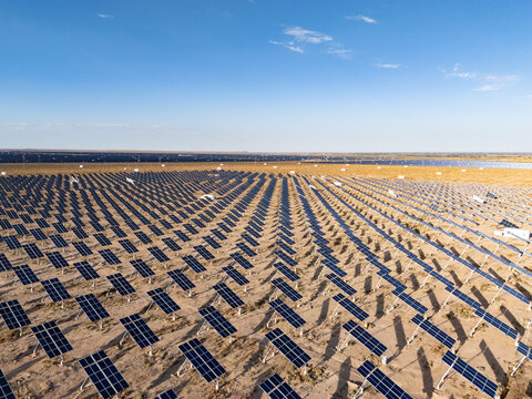 Neatly arranged solar photovoltaic panels in the desert generating clean energy