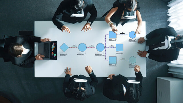 Team Collaborating with Virtual Reality Technology to Create Innovative Solutions at a Modern Workspace with Focused Attention and Engagement Quark.