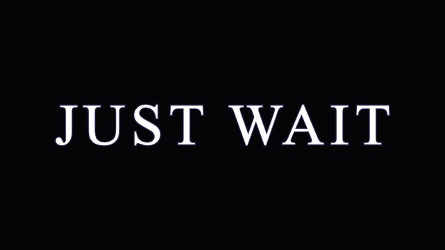 Text overlay 'JUST WAIT' in cinematic motion on dark background with subtle light effects for anticipation