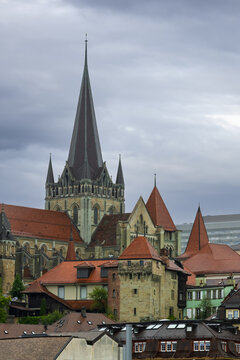 Lausanne Cathedral spire towering over Lausanne city rooftops