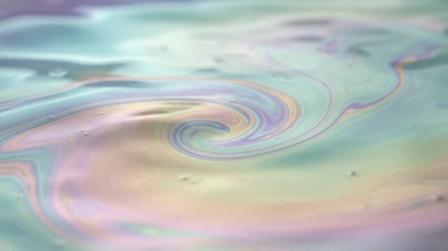 abstract iridescent liquid water swirl pastel rainbow fluid wave motion background