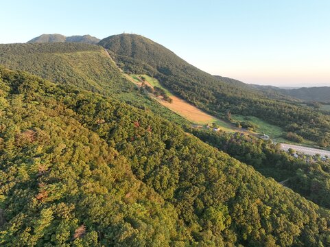 Sunrise over Mount Sanbe in Shimane, Japan, with the mountain glowing in warm morning light