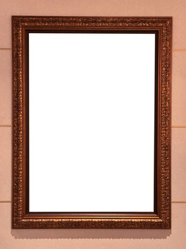 Mock up blank poster frame hanging on wooden wall in room.
