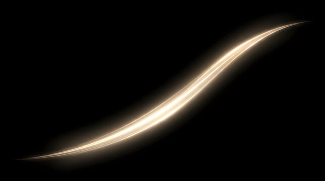 A beautiful elegant golden light streak flows across a dark black background symbolizing energy movement and a feeling of powerful dynamic illumination