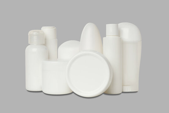 Cosmetics. Collection of white cosmetic bottles showcases essentials for personal care