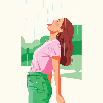 Woman enjoys rain outdoors, head tilted back, licking drops, green trees background