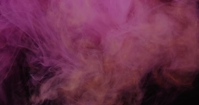 Paint mix. Fume drop explosion. Defocused orange pink color glitter water dye liquid particles cloud texture spreading on abstract dark black background.