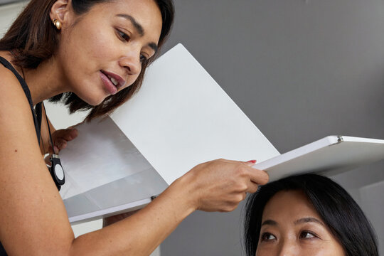Agency Founder Presenting Blank Storyboard to Client