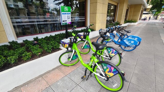 BKK Bike Sharing bicycles at a public bike sharing station at the Bangkok City Library in Bangkok, Thailand