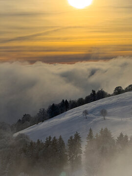 Winter sunset over jura mountains with clouds, jura; france