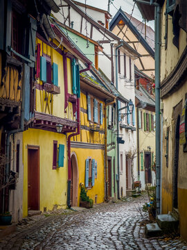 Eguisheim village street with colorful half timbered houses
