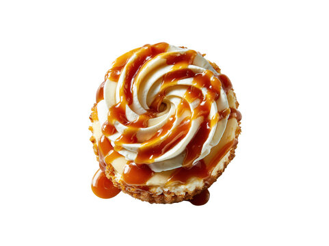 Top view of a delicious cupcake with white frosting and caramel sauce drizzle isolated