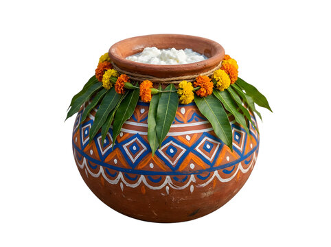 Traditional dahi handi clay pot with marigold flowers and mango leaf.