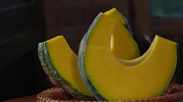 Fresh Japanese pumpkin, sliced ​​and placed in a basket.