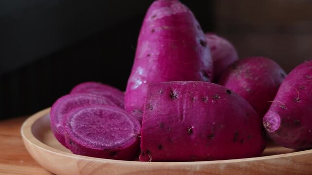 Japanese purple sweet potato in a wooden plate.