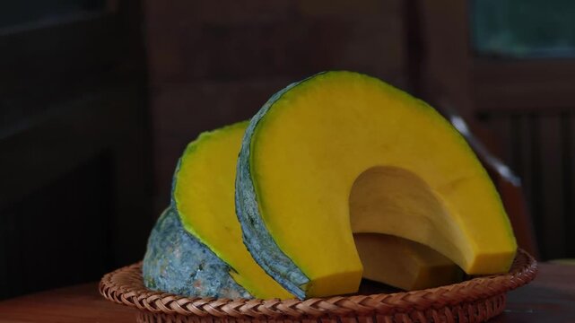 Fresh Japanese pumpkin, sliced ​​and placed in a basket.