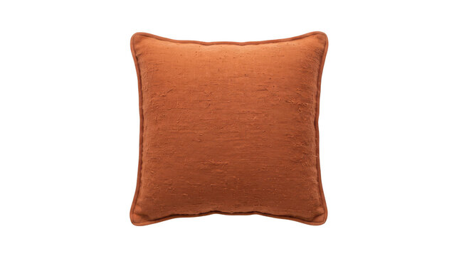 A square decorative throw pillow with a textured, burnt orange fabric cover and piped edges, isolated on transparent background