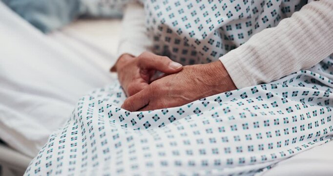 Anxiety, consultation and hands of woman in hospital with scared for medical diagnosis or treatment. Mental health, uncertain and nervous patient waiting on bed for cancer checkup in clinical ward.
