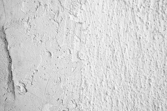 Textured white concrete wall background with rough details