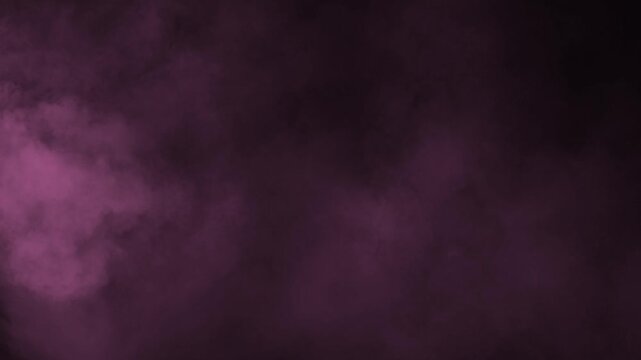 Billowing soft pink fog and haze drifting gently across dark background