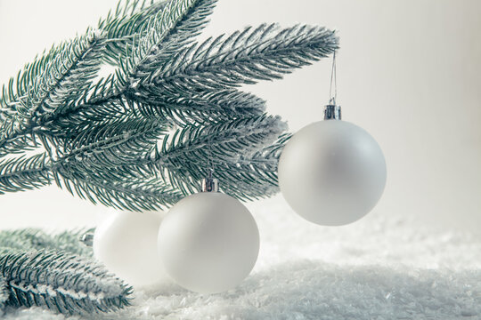Christmas and New Year background with fir branches, white balls and snow