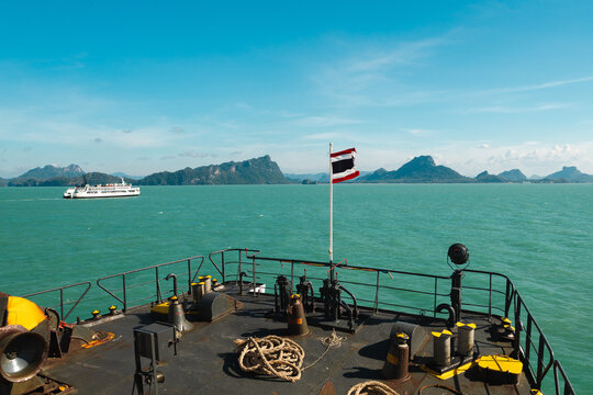 Thai Flag Flying from Ferry Bow Above Turquoise Sea and Island
