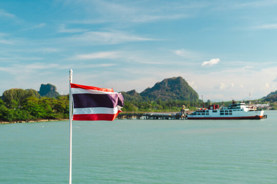 Thai Flag and Ferry on Mountainous Donsak Waterfront