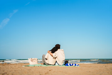 Fototapeta premium Couple hugging at beach, enjoying summer vacation and relaxation