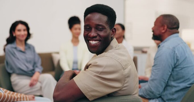 Counseling, smile and man in support group for therapy, rehabilitation circle and healing session. Office, face and happy person in psychology meeting for recovery, help and mental health wellness