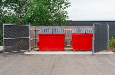 Obraz premium large red commercial dumpster for trash and recycling